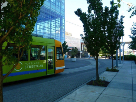 Streetcar behind the OHSU Center for Health & Healing &mdash; note Tram station just beyond