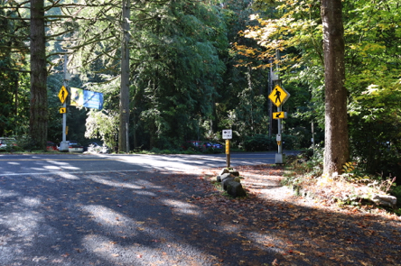 Crosswalk from one parking lot to another with traffic warning signal