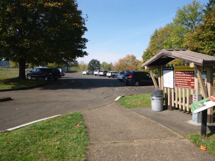 Curb-cut from parking lot to visitor center &ndash; informational kiosk &ndash; pay station &ndash; garbage can &ndash; bike map