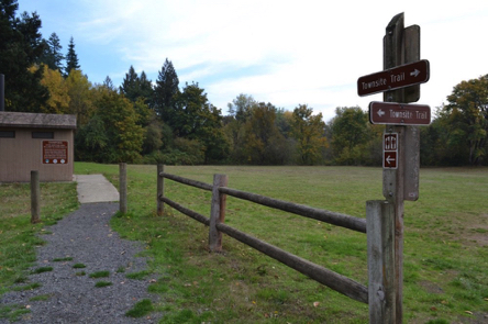 Accessible vault toilets at boat ramp and group camping &ndash; compact gravel to concrete walkway &ndash; Townsite Trail sign
