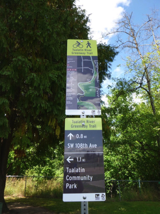 Example of directional signage located in park &ndash; sign for Tualatin River Greenway Trail and Tualatin Community Park