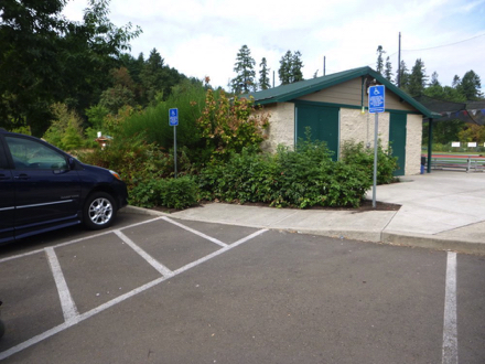 Paved surface trail by river and community garden &ndash; picnic shelter