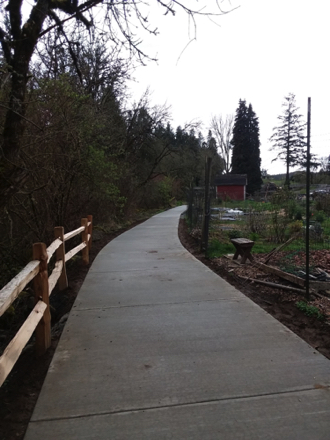 Hard surface route by river and garden &ndash; two shelters