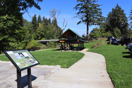 Interpretive display about historic farmhouse &ndash; picnic shelter &ndash; parking lot near main park area
