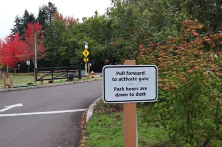 Sign: Pull forward to activate gate – park hours dawn to dusk Sign: Pull forward to activate gate – park hours dawn to dusk