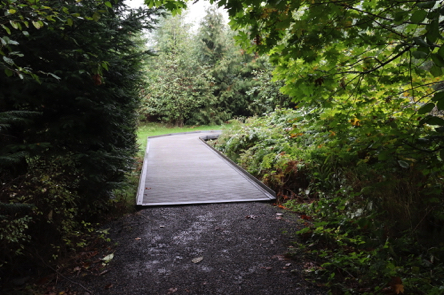 Crushed rock Coyote Way Trail transitions to a metal boardwalk Crushed rock Coyote Way Trail transitions to a metal boardwalk