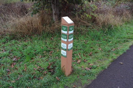 Trail junctions have trail markers with a trail map on top Trail junctions have trail markers with a trail map on top