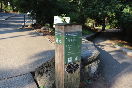 Parking lot with one accessible space, bus stop and trailhead on SW Fairview Blvd