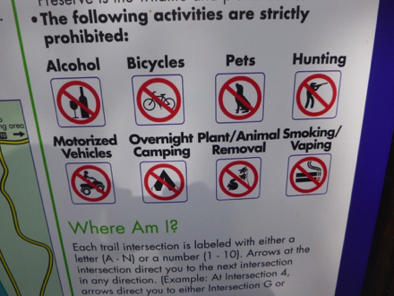 Sign &ndash; Strictly prohibited: alcohol, pets, biking, hunting, vehicles, camping, removing plants/animals, smoking