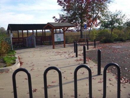 North view parking lot &ndash; accessible parking &ndash; shelter &ndash; bike racks &ndash; Blink EV charging stations &ndash; gate closes when flooded