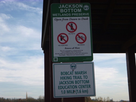 Sign &ndash; &ldquo;Jackson Bottom Wetlands Preserve &ndash; open dawn to dusk &ndash; Bobcat Marsh Hiking Trail to education center &ndash; 1 mile&rdquo;