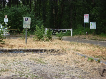 Parking lot on the Willamette River side of park - hard surface - accessible parking space - lot is not well maintained