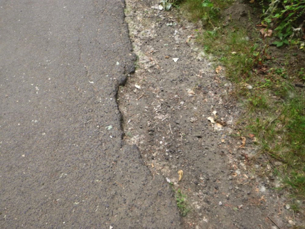 Hard surface trail - erosion on the side of trail - lip to soft surface