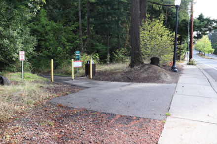 Connector trail from street &mdash; natural surface trail to main trail &mdash; signage and garbage can