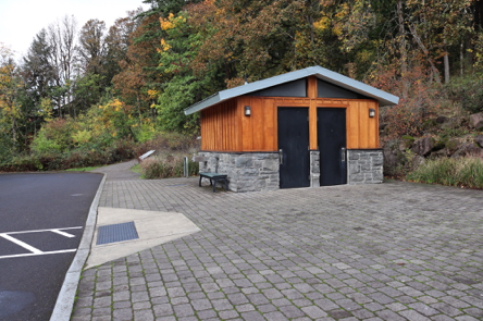 Mather Road from parking lot, crosswalk and curb cut &ndash; unisex restrooms &ndash; interpretive displays &ndash; drinking fountain &ndash; trailhead