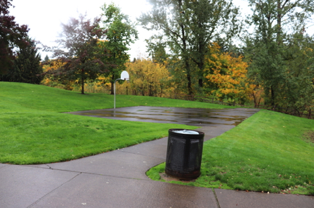 Hard surface path to single basketball hoop &ndash; garbage can