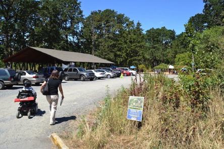 Gravel parking lot for a picnic area and fenced off-leash pet area