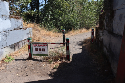Bollards to keep out vehicles &ndash; Fire Danger sign &ndash; wildfire hazard zone