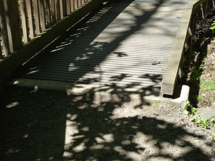 Settling of dirt has created severe lip at boardwalks