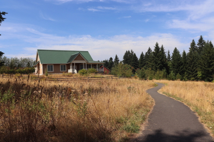 Paved Pipeline Lane Trail and caretaker&rsquo;s house - transitions to natural surface with gravel