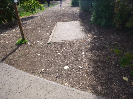 Shortcut to disc golf course &ndash; paved trail to natural surface &ndash; paved section may have a lip