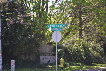 Street signs: SE Rood bridge Rd and SE Singing Woods Dr &ndash; near Park entrance