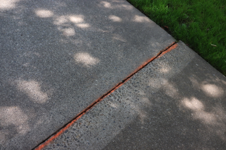 Lip on sidewalk is marked with bright paint