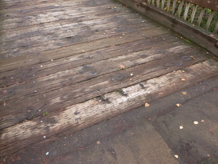 Transition from hard surface to wooden bridge at Klineline Ponds &ndash; railing on bridge over Salmon Creek