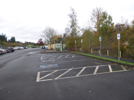 Hard surface parking lot &ndash; accessible parking spaces &ndash; sidewalk to the entrance to ponds and amenities