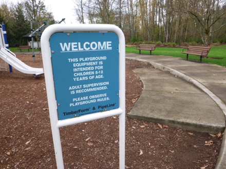 Sign at playground &ndash; equipment intended for children 5-12 &ndash; adult supervision is recommend &ndash; please observe rules