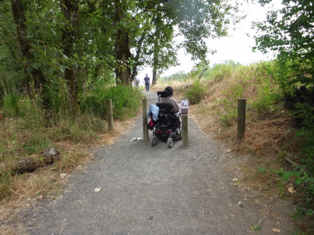 Trailhead to Confluence Trail &ndash; compacted gravel &ndash; encroaching grass on hard-packed soil surface