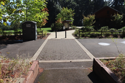 Porta-potty, kiosk with park map, picnic shelter and restrooms at main (upper) parking lot