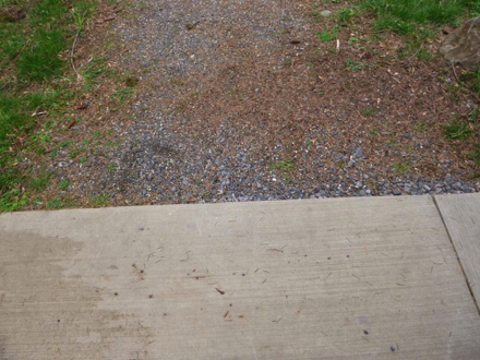 Paved surface to natural surface may require maintenance to avoid a lip Paved surface to natural surface may require maintenance to avoid a lip