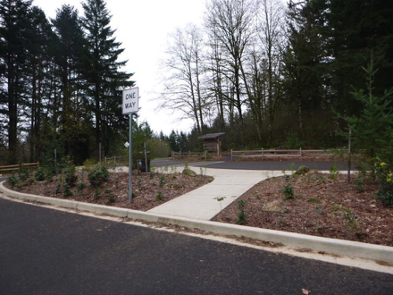 Park kiosk and trash can at main parking lot