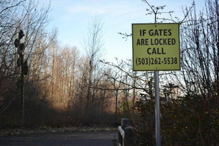 Park closure sign with emergency number