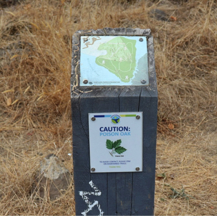 Post topped with map of trails on Elk Rock Island &ndash; poison oak