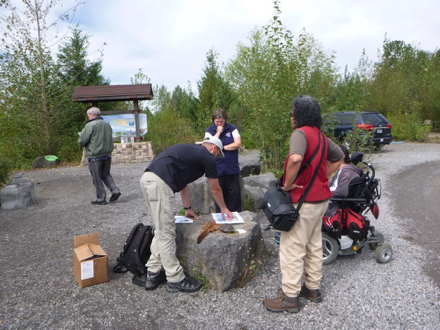 Volunteer trail stewards share educational materials and walk trails 5 times a week to answer questions