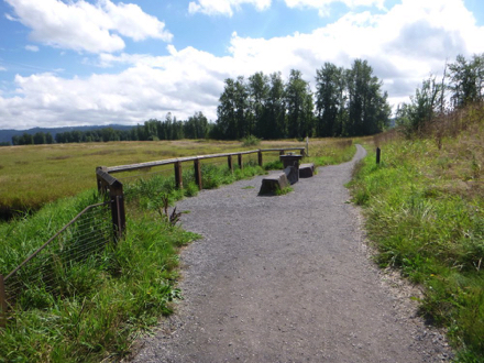 Seating area overlooking the lake &ndash; wide compacted gravel trail &ndash; interactive educational art piece about water