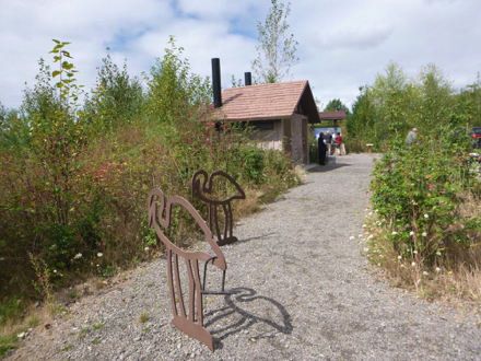 Art work at the parking lot is a bike rack &ndash; vault toilets &ndash; informational kiosk