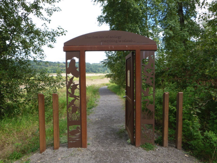 Decorative door to the wetland trail area that is closed in the off-season &ndash;  closed October through April