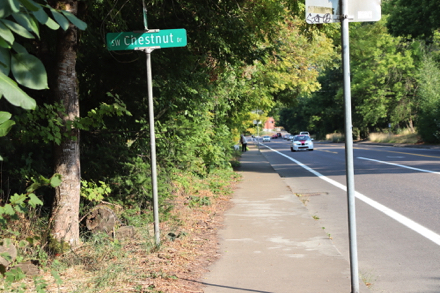 Sidewalk that leads to the compacted gravel trailhead