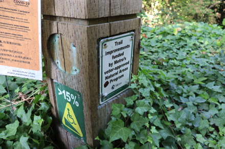 Location sign at the compacted gravel trailhead