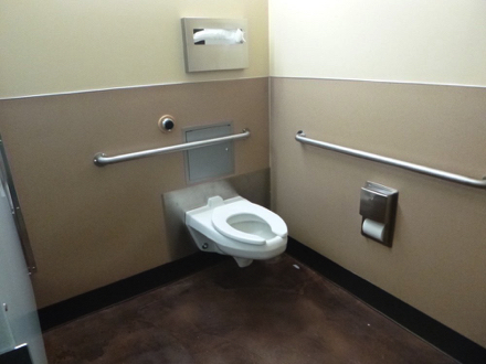 Accessible stall in women's restroom at nature center - handrails on wall