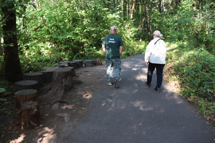 Natural seating and play area at trailhead &ndash; off paved trail on natural surface