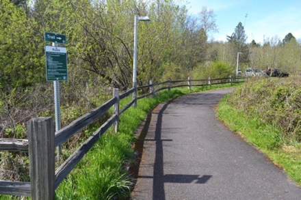 Hard surface path from Millikan Way to the parking lot and nature center - sign with rules for the nature park