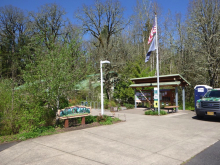 Plaza at start of the park - hard surface - covered informational kiosk - bench - welcome sign