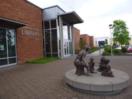 Entrance at Tualatin Public Library - sidewalk to crosswalk at trail entrance - parking at library