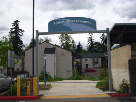 Trail entrance sign - trail entrance with tactile strip located behind Nyberg Rivers shopping complex