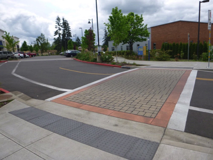 Brick crosswalk from Tualatin Public Library to Tualatin River Greenway Trail &ndash; tactile strip