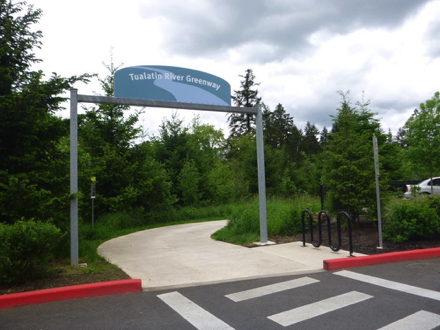 Entrance sign for trail behind Cabela's - crosswalk - hard surface - bike rack - map - parking